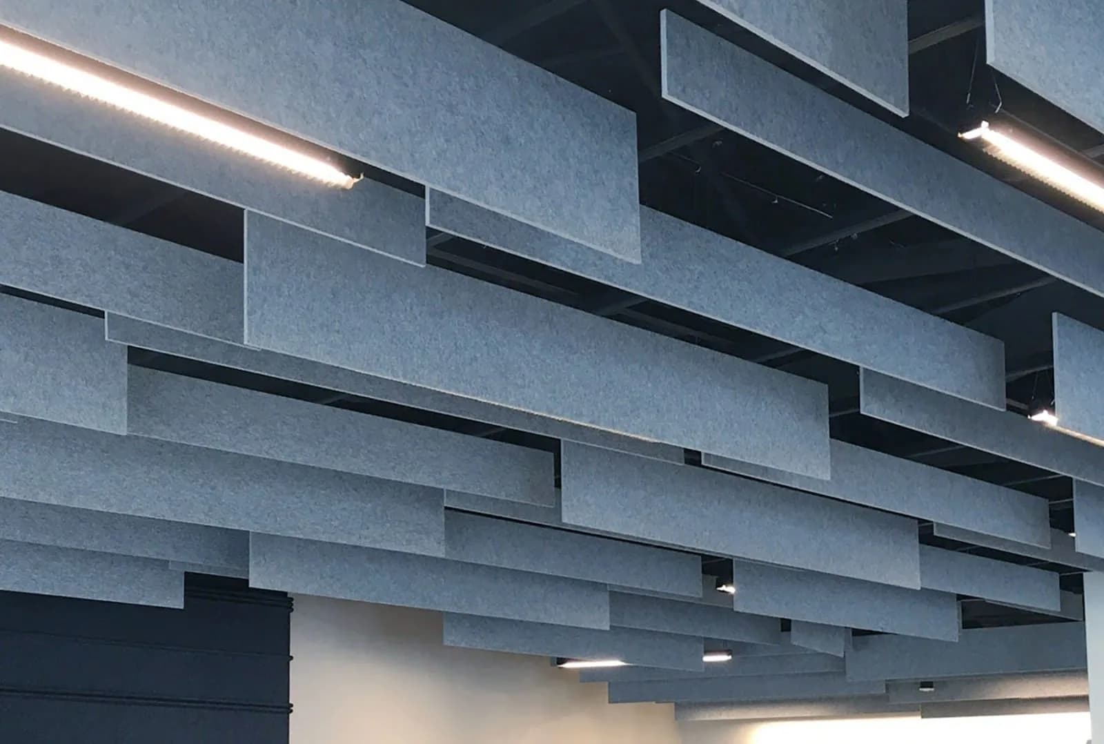 Acoustic ceiling panels finished to match a commercial interior