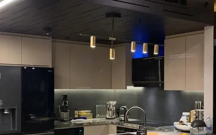Home kitchen with a suspended acoustic ceiling baffle system